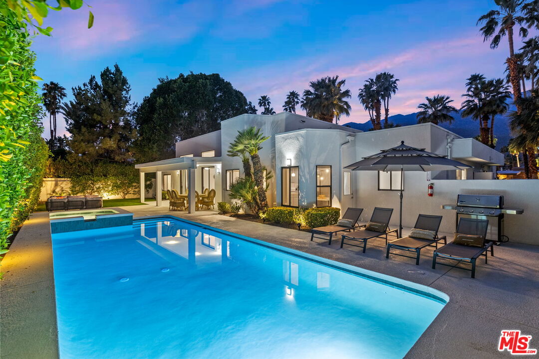 1414 Sagebrush Road Palm Springs, CA 92264 - Photo 5 of 48 a view of a swimming pool with outdoor seating