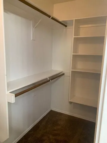 a view of an empty walk in closet