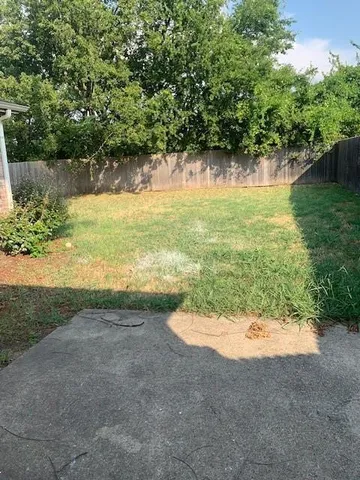 a view of a lake with a yard