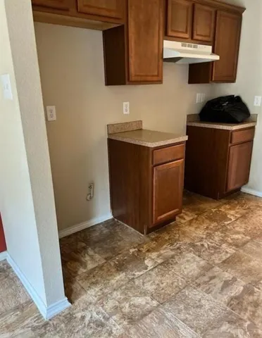 a kitchen with a stove and a microwave