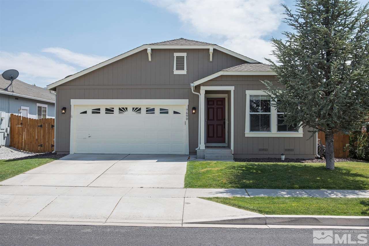 7690 Appenzell Street Reno, NV 89506 - Photo 1 of 25 a front view of a house with a yard