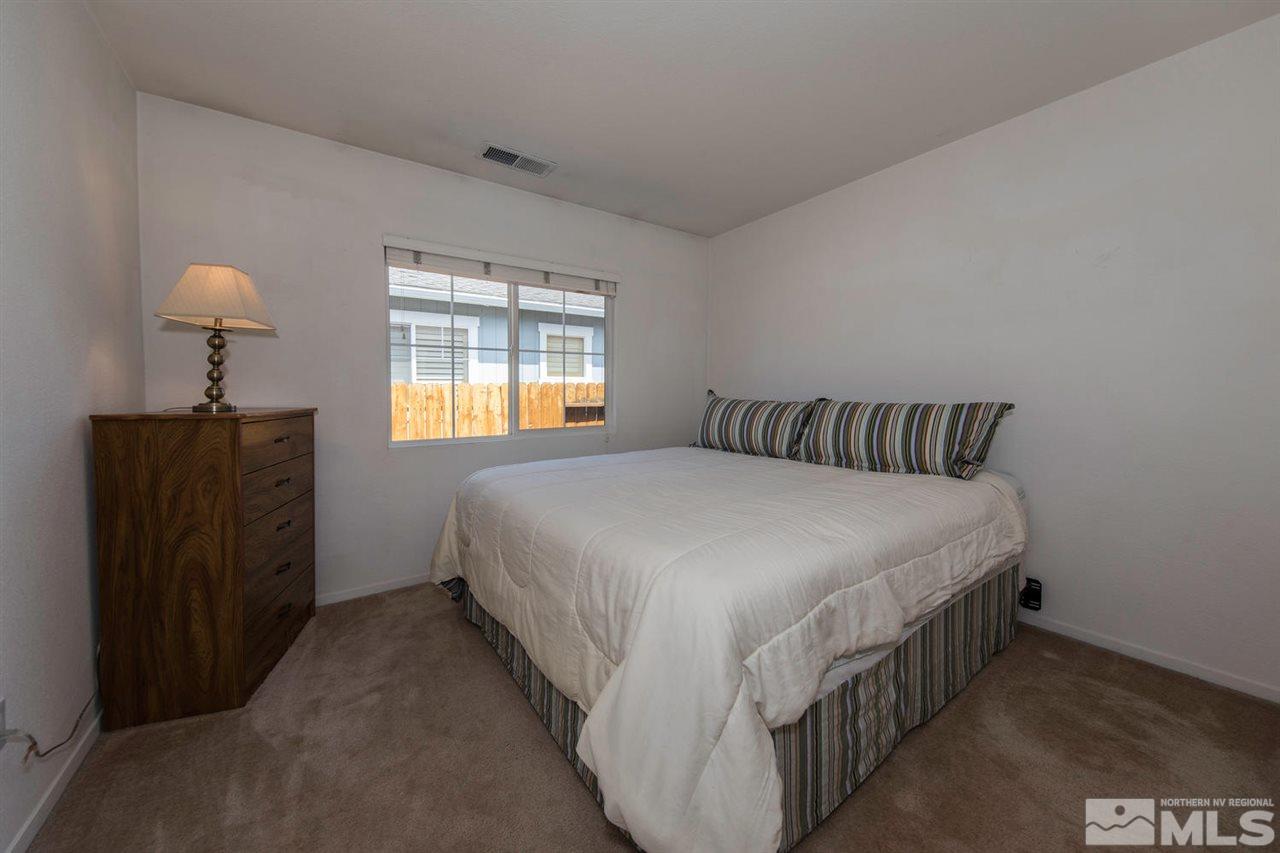 7690 Appenzell Street Reno, NV 89506 - Photo 18 of 25 a bedroom with bed and window