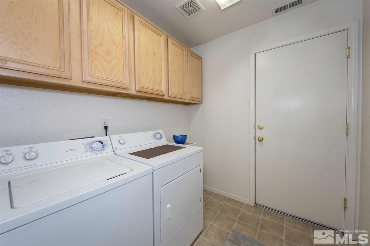 7690 Appenzell Street Reno, NV 89506 - Photo 20 of 25 a utility room with dryer and washer