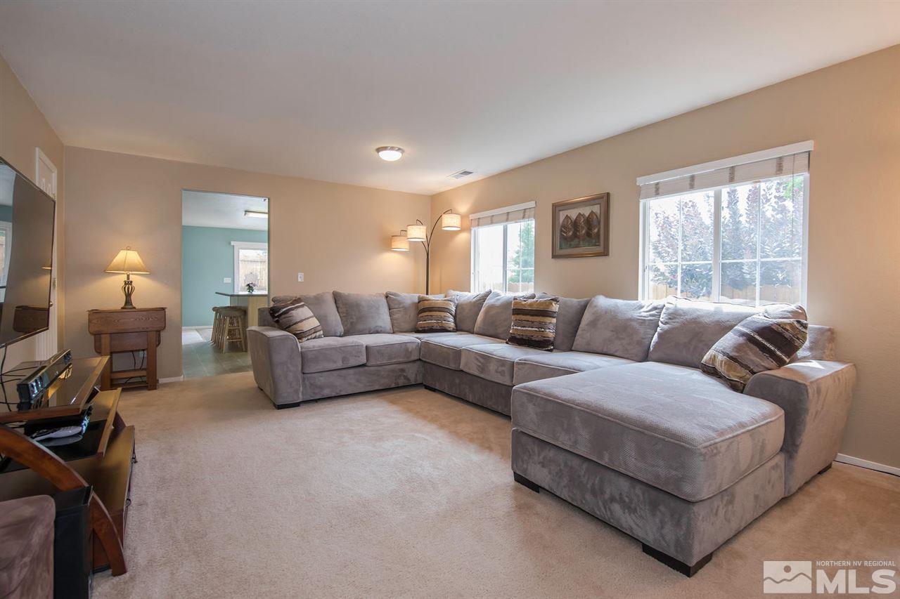 7690 Appenzell Street Reno, NV 89506 - Photo 4 of 25 a living room with furniture and a window