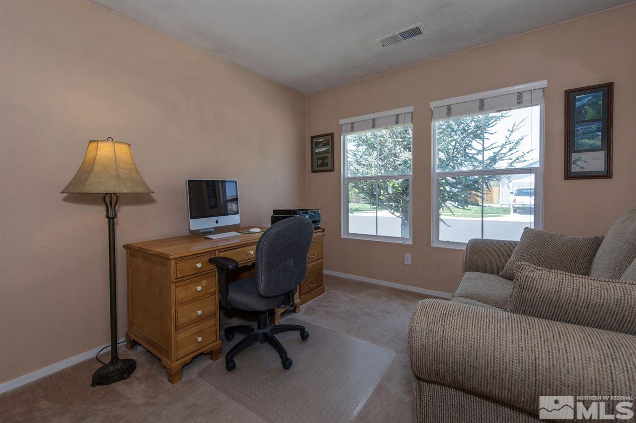 7690 Appenzell Street Reno, NV 89506 - Photo 5 of 25 a view of a livingroom with workspace and a window