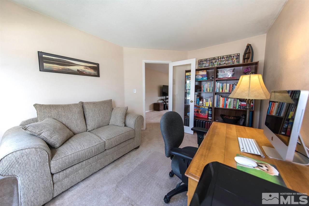 7690 Appenzell Street Reno, NV 89506 - Photo 6 of 25 a living room with furniture and a table