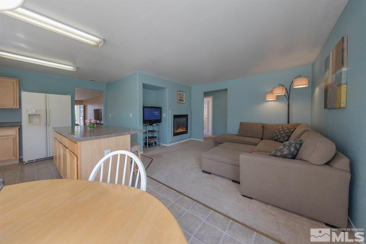 7690 Appenzell Street Reno, NV 89506 - Photo 7 of 25 a living room with furniture and a table