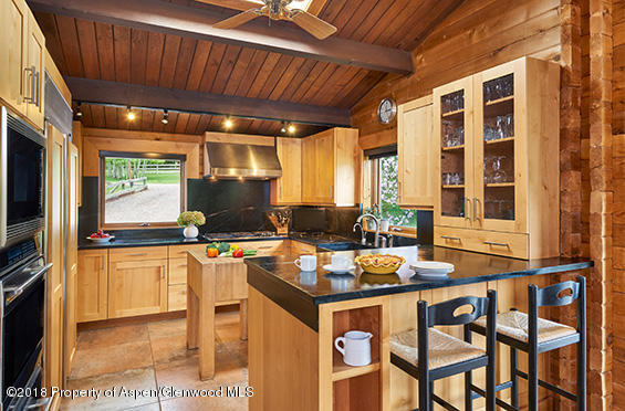 512 Holland Hills Road Basalt, CO 81621 - Photo 5 of 37 a kitchen with a stove and a refrigerator