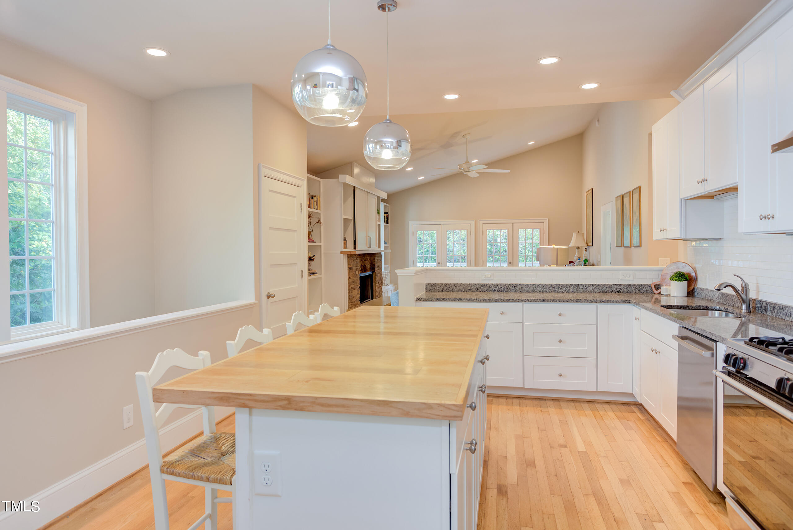 2222 Creston Road Raleigh, NC 27608 - Photo 11 of 57 a kitchen with stainless steel appliances granite countertop a sink stove and refrigerator