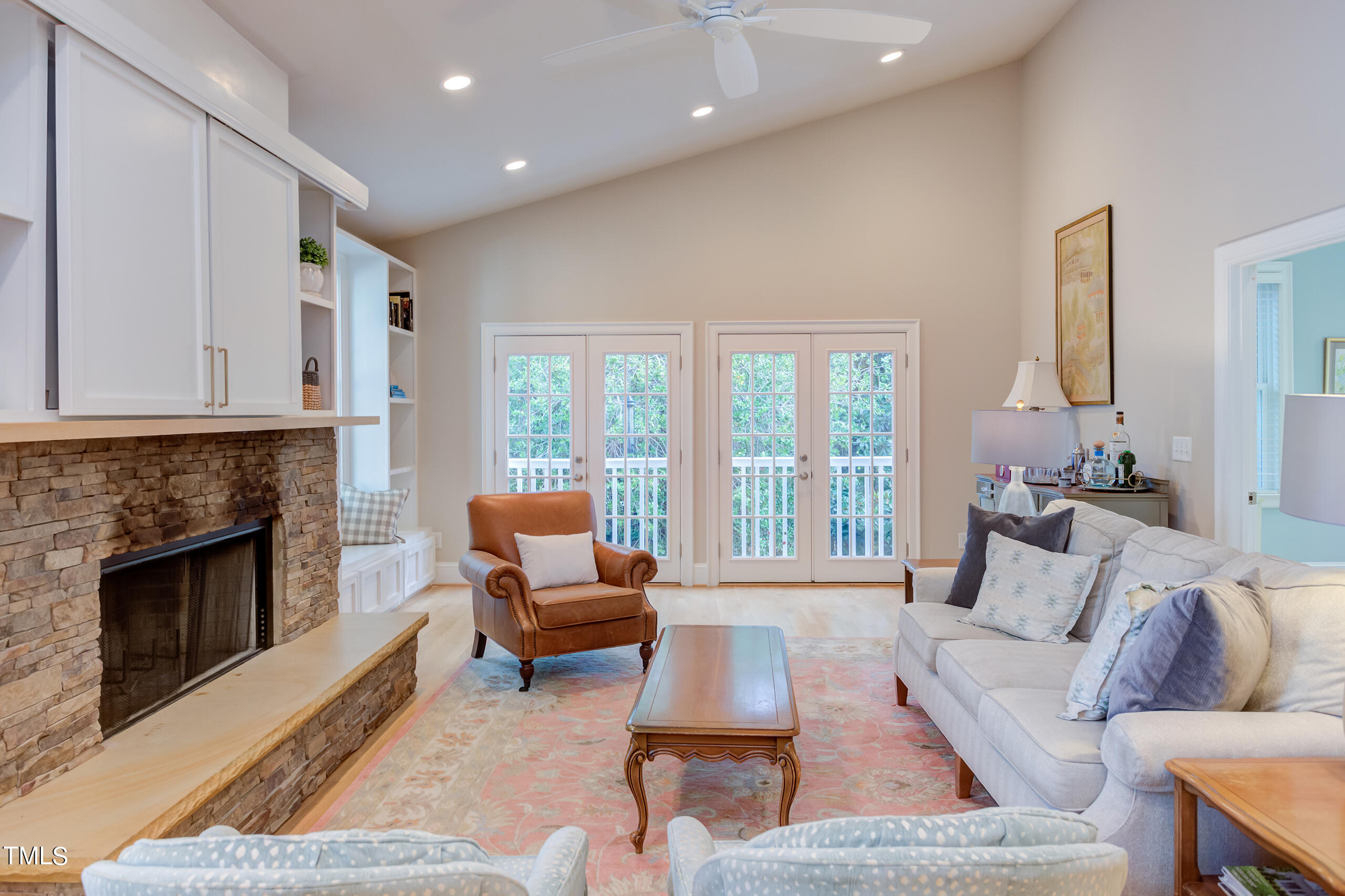 2222 Creston Road Raleigh, NC 27608 - Photo 17 of 57 a living room with furniture and a fireplace