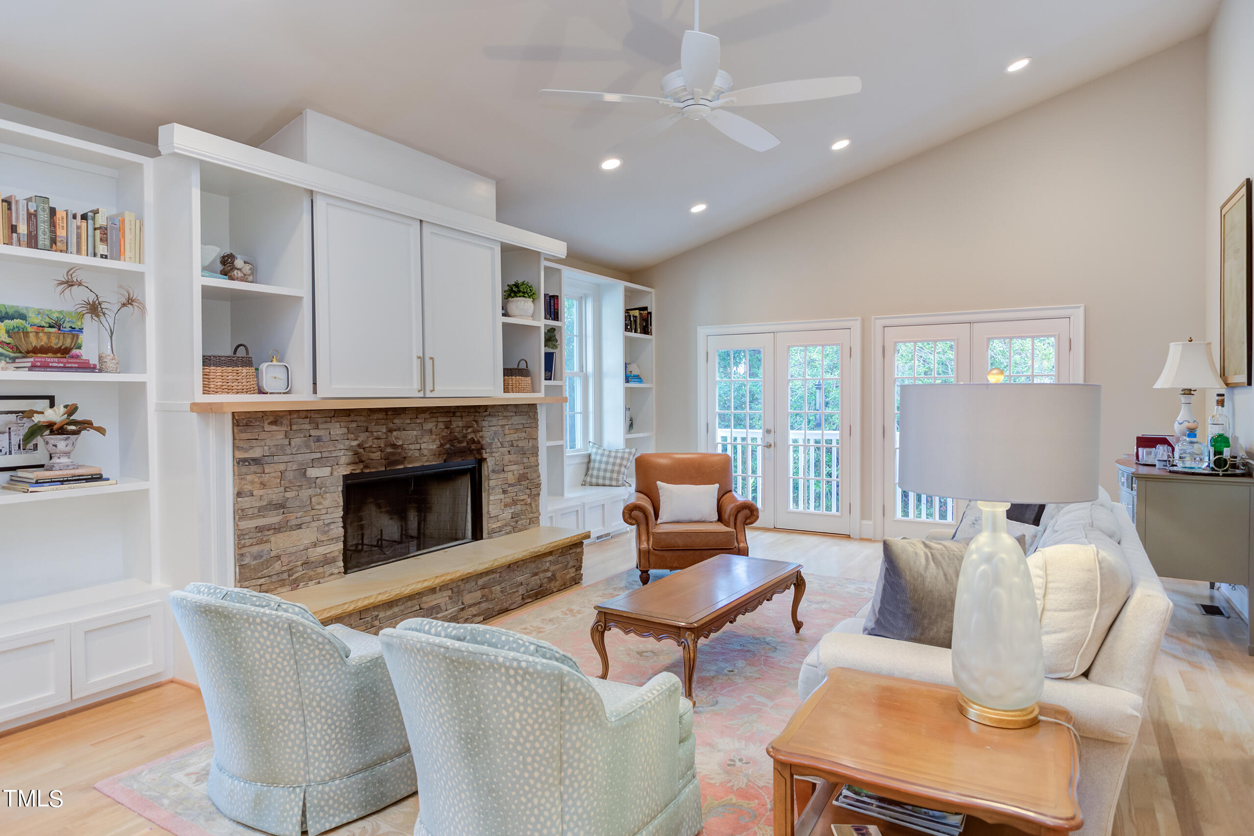 2222 Creston Road Raleigh, NC 27608 - Photo 18 of 57 a living room with furniture and a fireplace