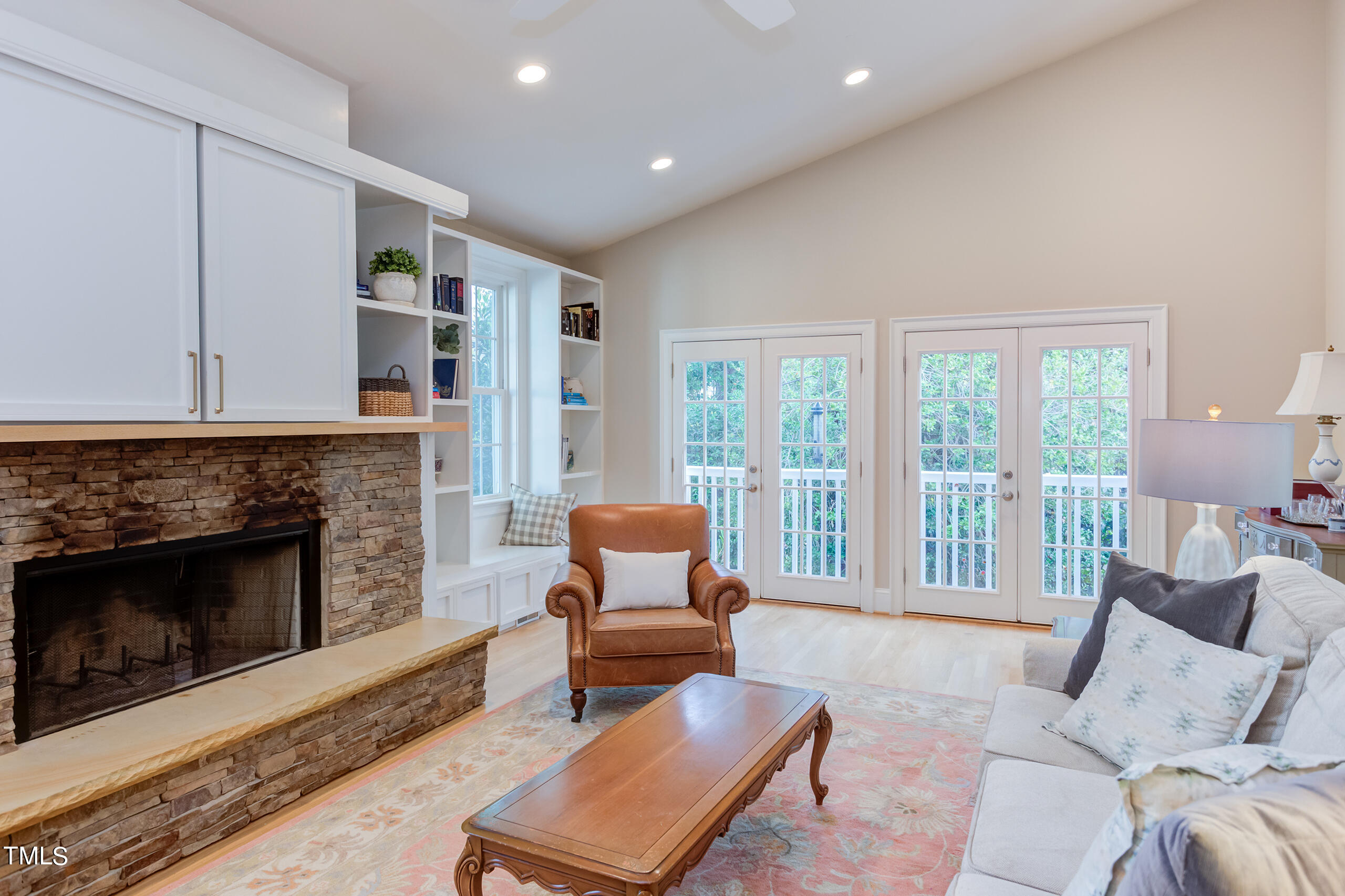 2222 Creston Road Raleigh, NC 27608 - Photo 19 of 57 a living room with furniture and a fireplace