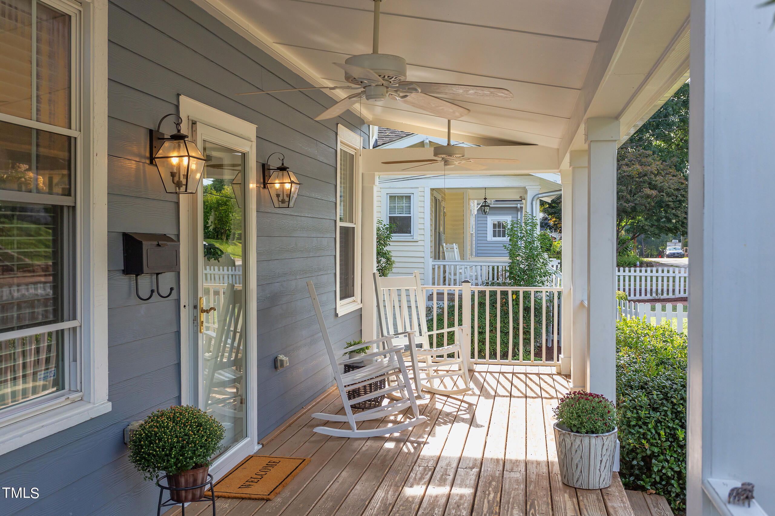 2222 Creston Road Raleigh, NC 27608 - Photo 2 of 57 a view of a balcony with wooden floor