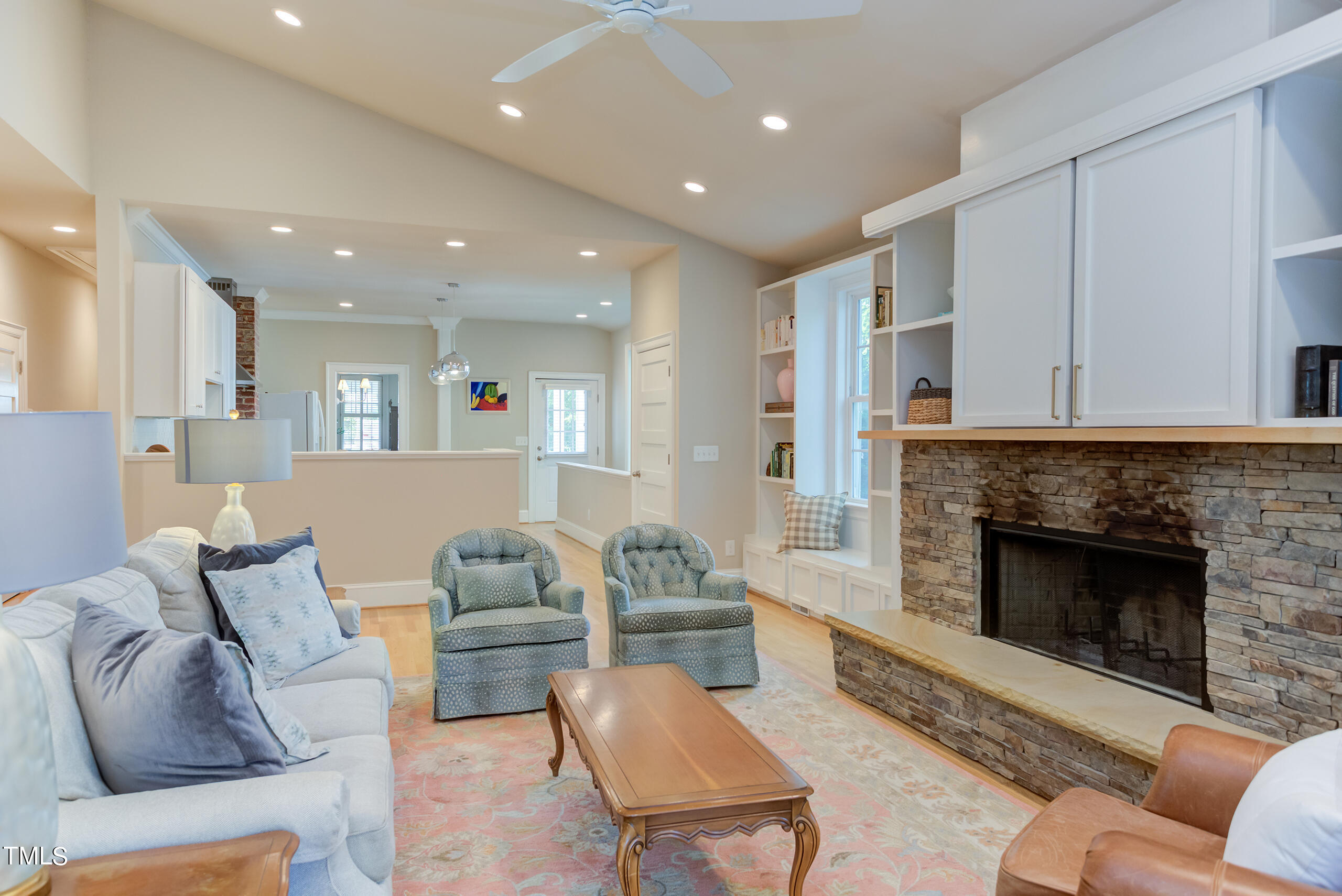 2222 Creston Road Raleigh, NC 27608 - Photo 22 of 57 a living room with furniture and a fireplace