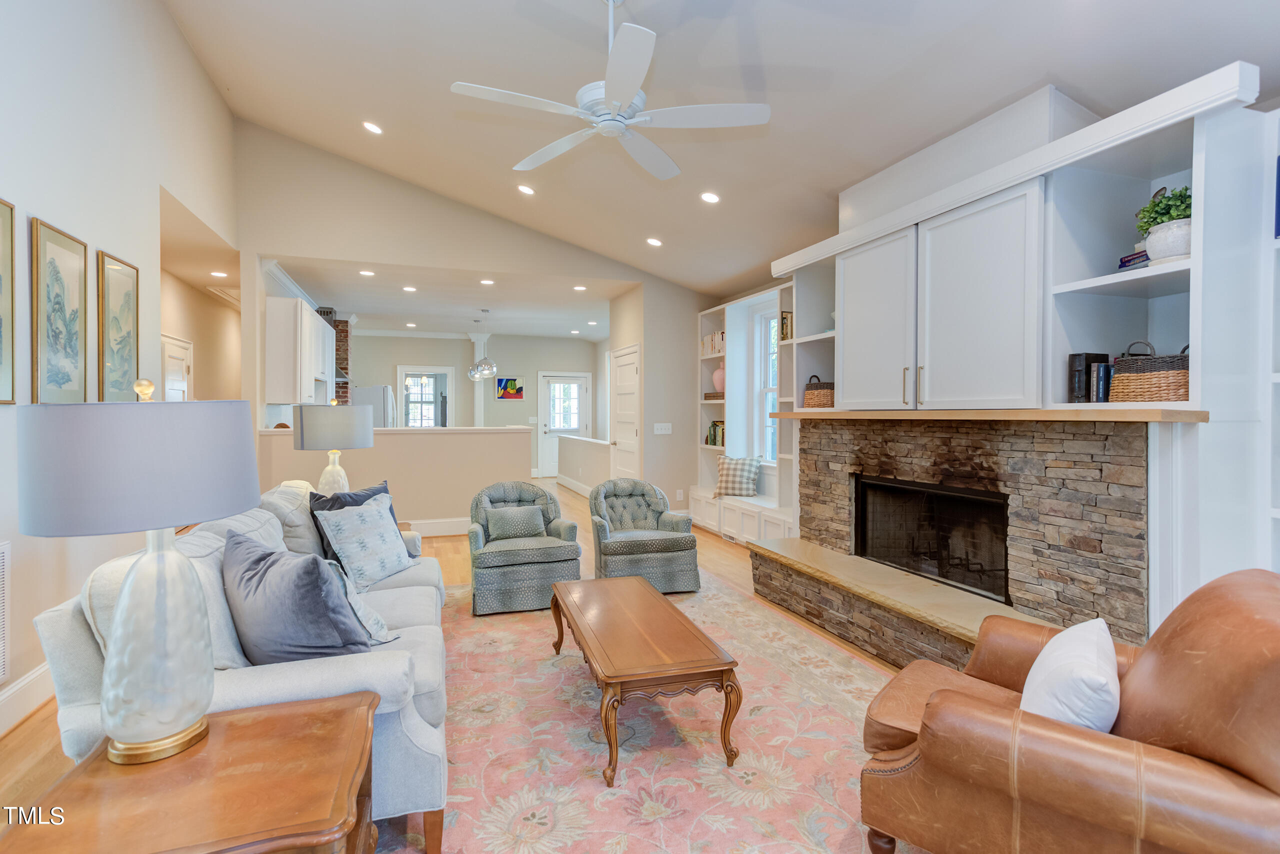 2222 Creston Road Raleigh, NC 27608 - Photo 23 of 57 a living room with furniture and a fireplace