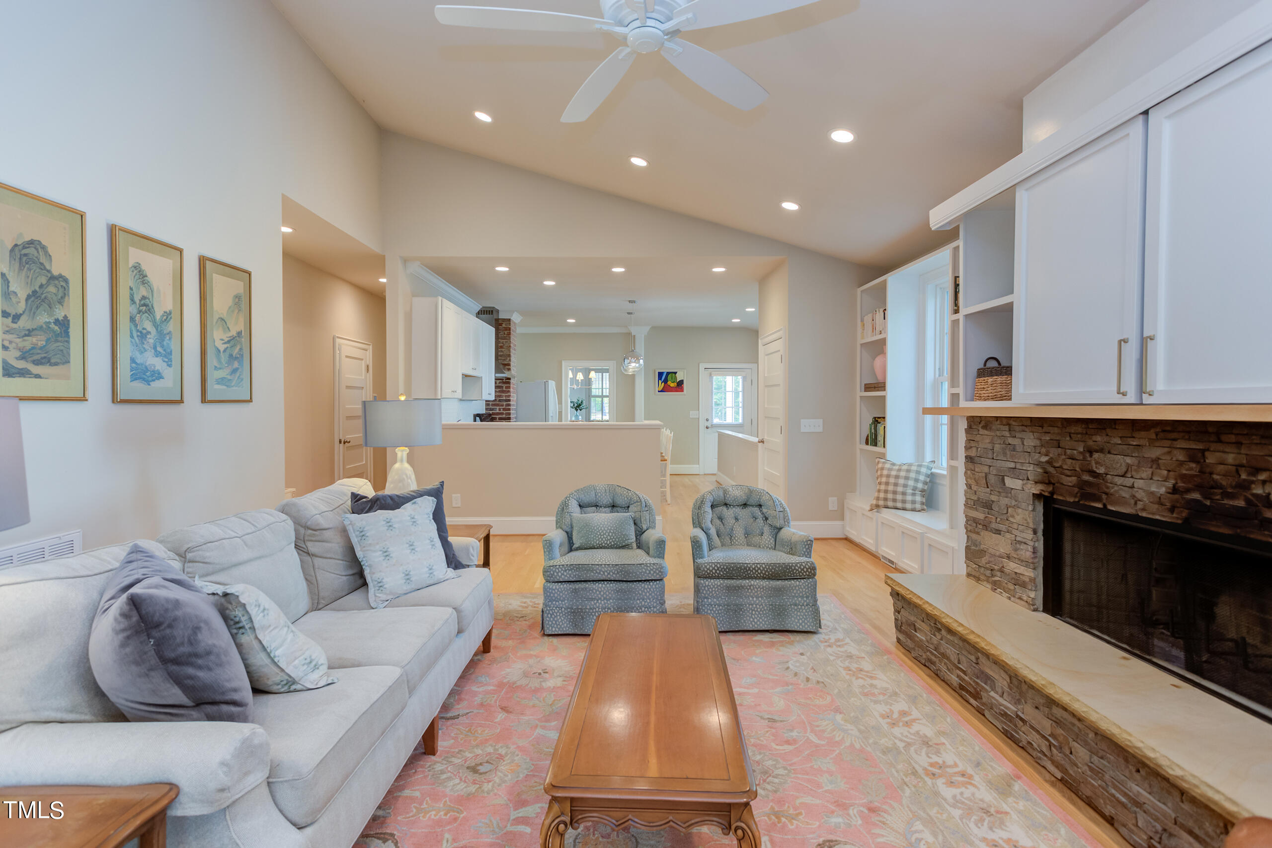 2222 Creston Road Raleigh, NC 27608 - Photo 24 of 57 a living room with furniture and a fireplace