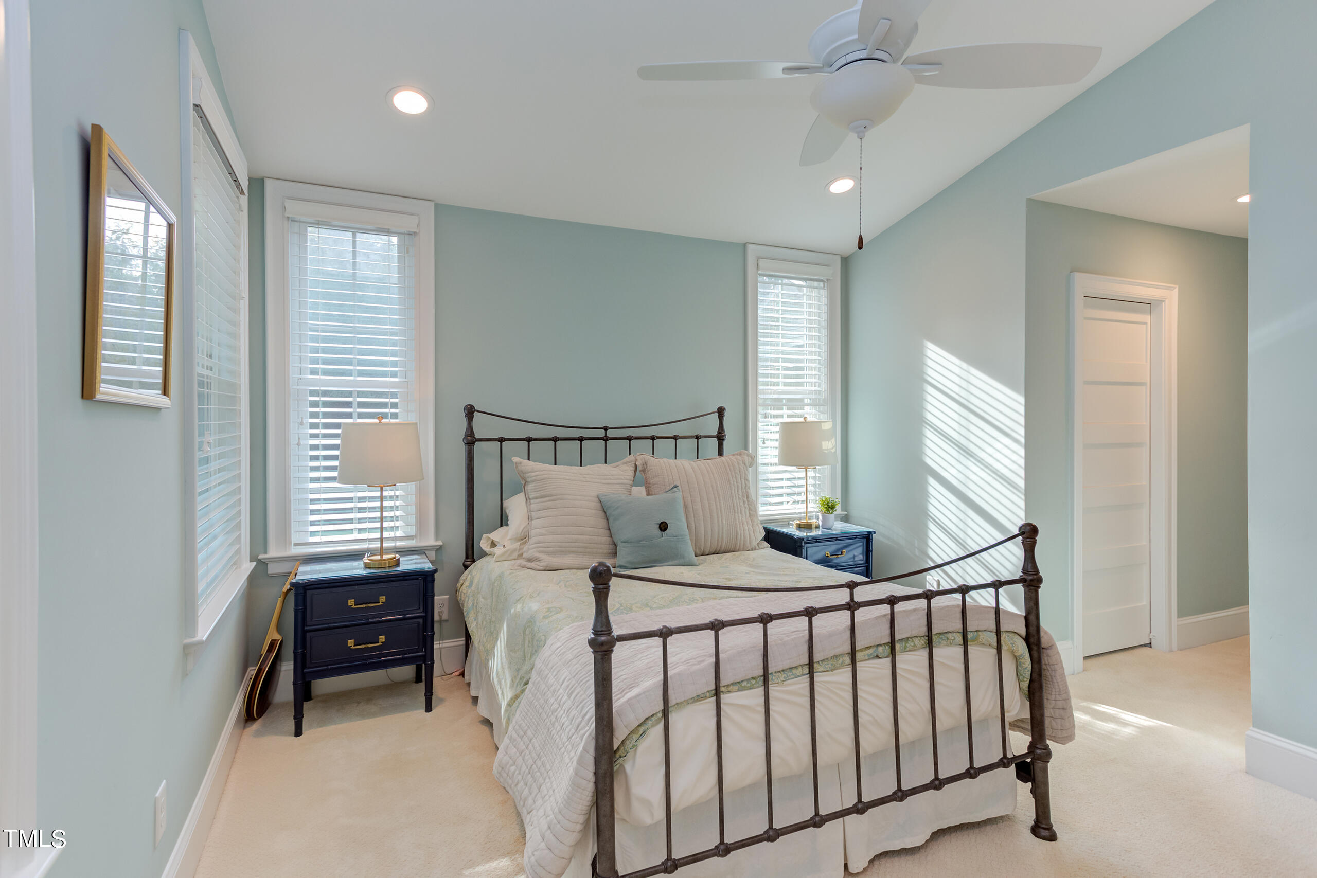 2222 Creston Road Raleigh, NC 27608 - Photo 28 of 57 a bedroom with a bed and a window