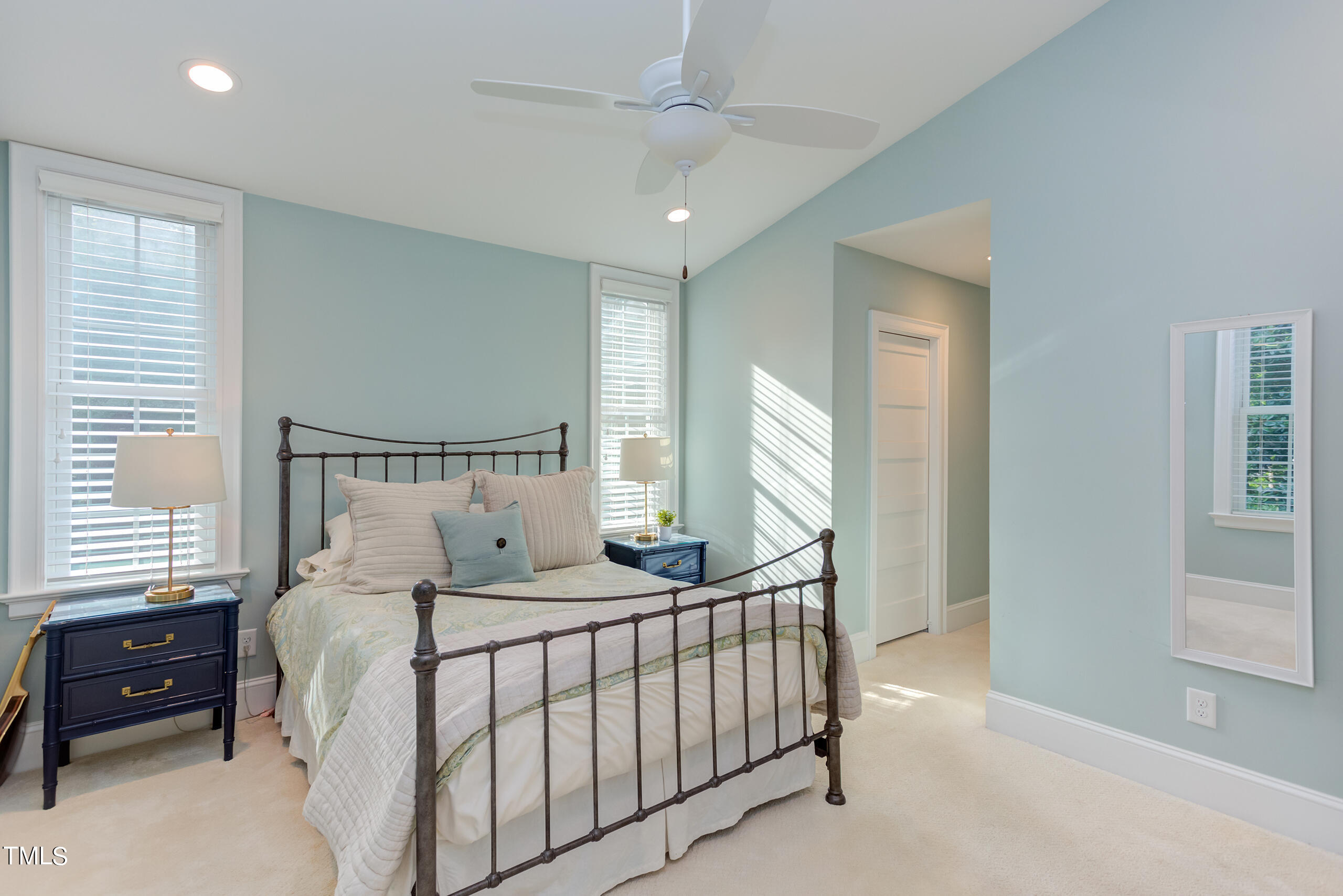 2222 Creston Road Raleigh, NC 27608 - Photo 29 of 57 a bedroom with a bed a window and dresser