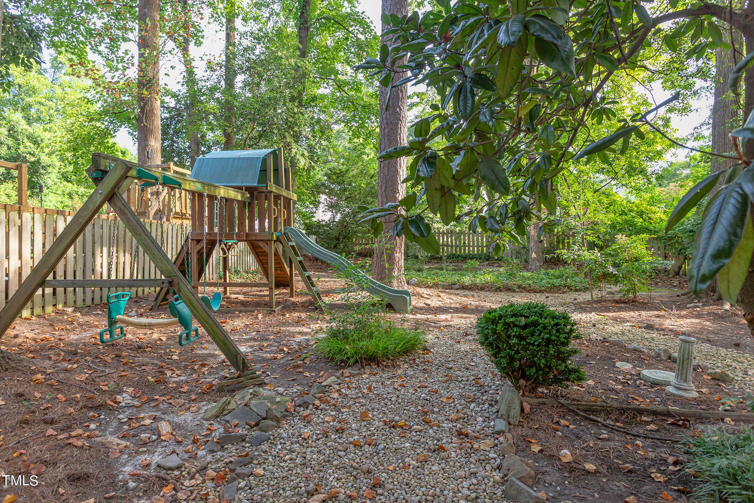 2222 Creston Road Raleigh, NC 27608 - Photo 50 of 57 a view of outdoor space with trampoline