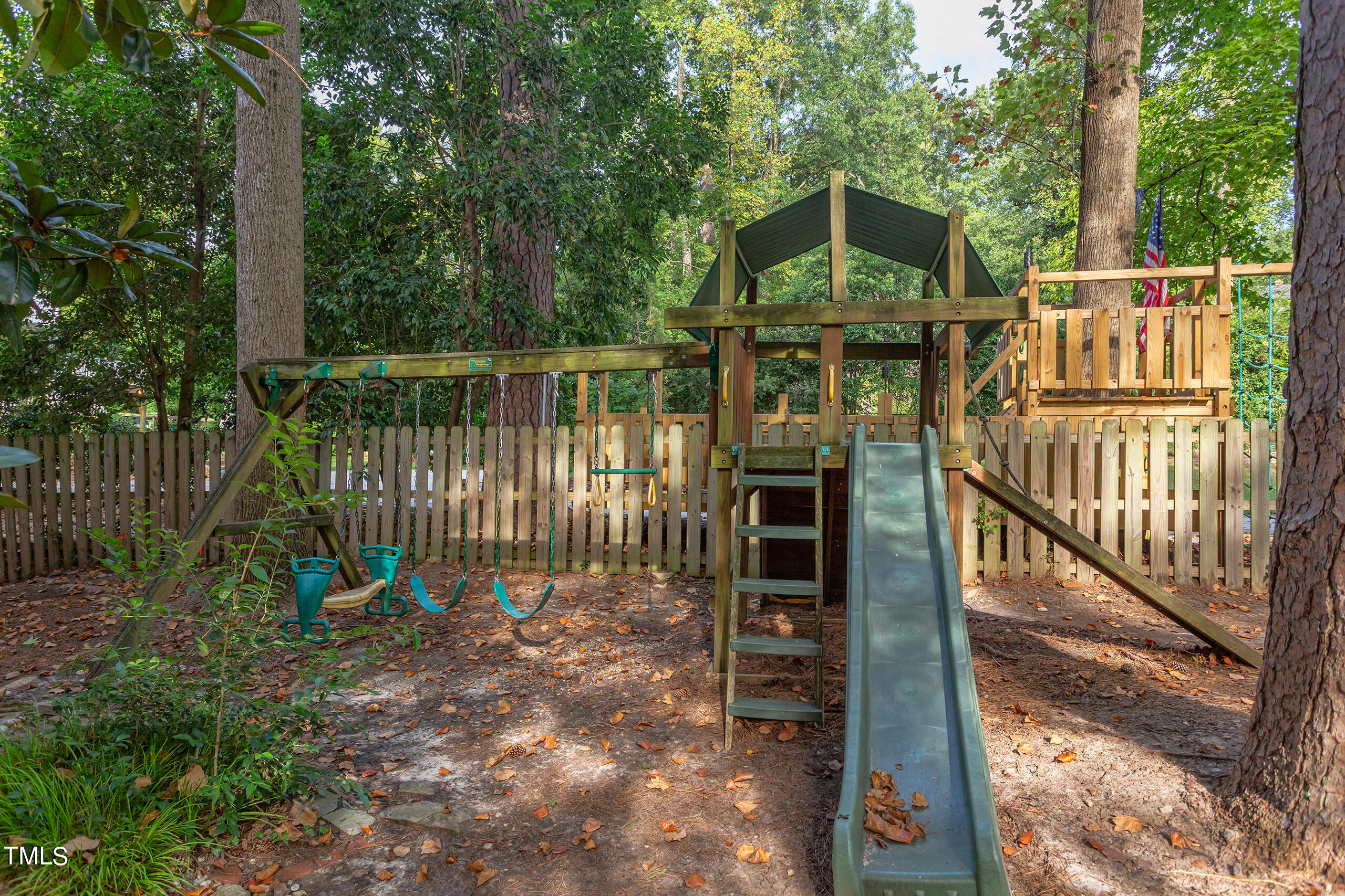 2222 Creston Road Raleigh, NC 27608 - Photo 52 of 57 a view of a house with backyard and deck