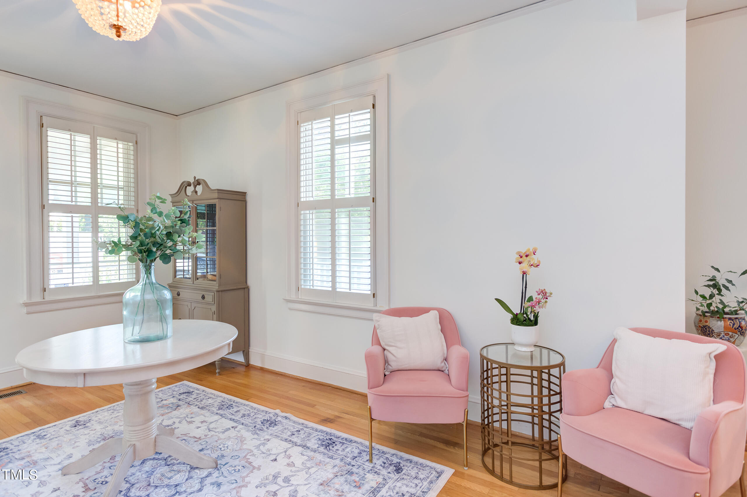 2222 Creston Road Raleigh, NC 27608 - Photo 8 of 57 a living room with furniture and a potted plant
