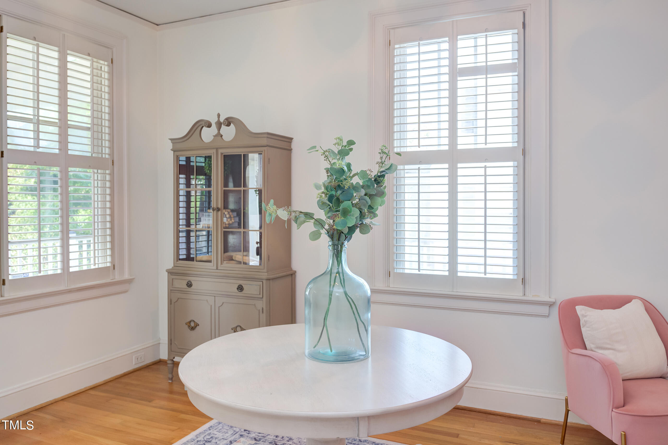 2222 Creston Road Raleigh, NC 27608 - Photo 9 of 57 a dining room with table chairs and a chandelier