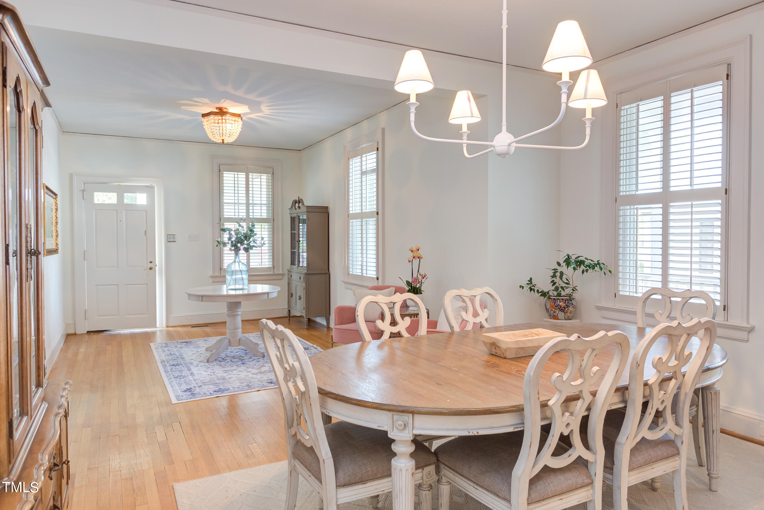 2222 Creston Road Raleigh, NC 27608 - Photo 10 of 57 a view of a dining room with furniture window and wooden floor