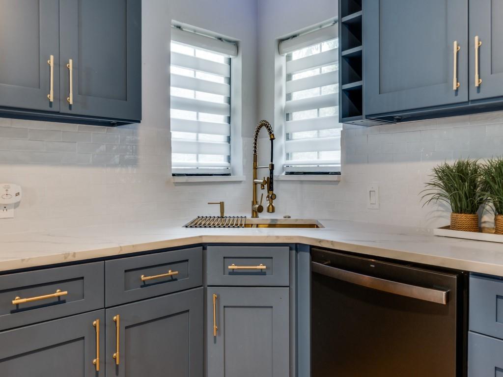 5739 Ellsworth Avenue Dallas, TX 75206 - Photo 12 of 38 a kitchen with a sink and cabinets