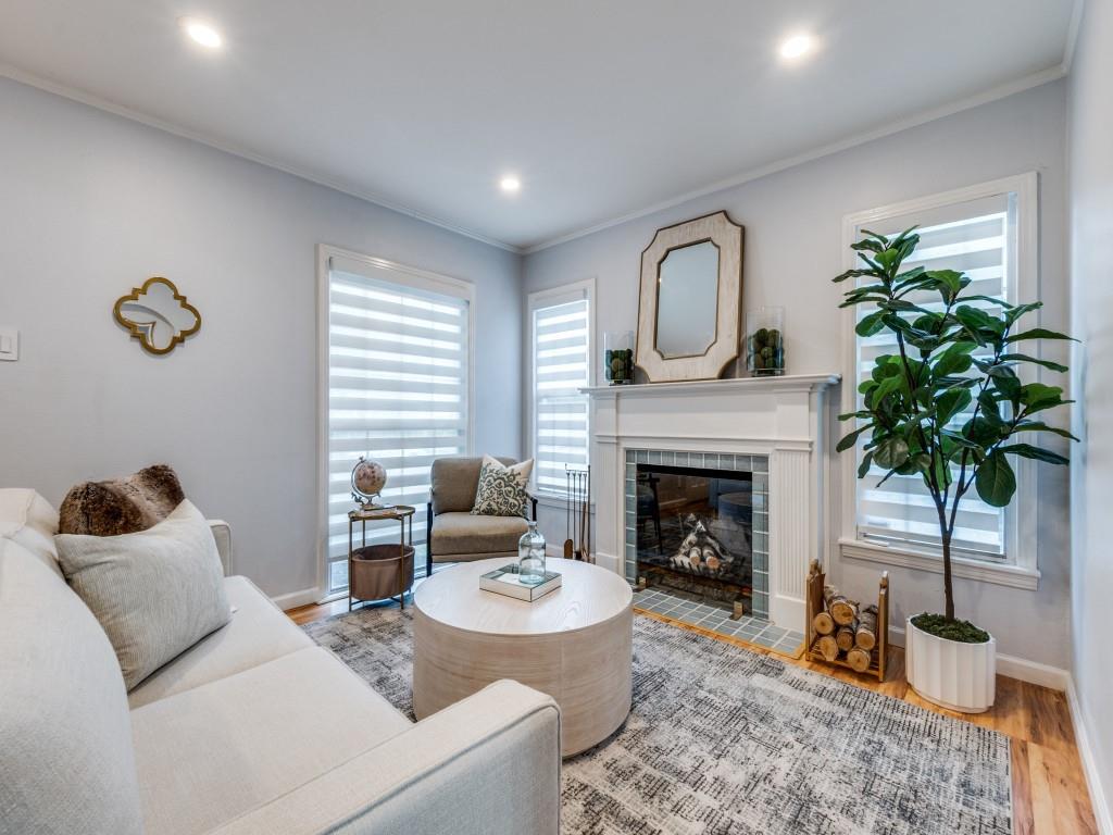 5739 Ellsworth Avenue Dallas, TX 75206 - Photo 2 of 38 a living room with furniture and a fireplace