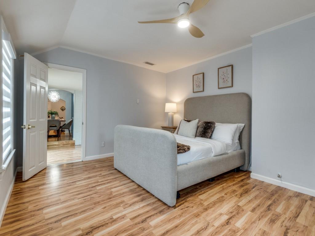 5739 Ellsworth Avenue Dallas, TX 75206 - Photo 22 of 38 a spacious bedroom with a bed and a walk in closet