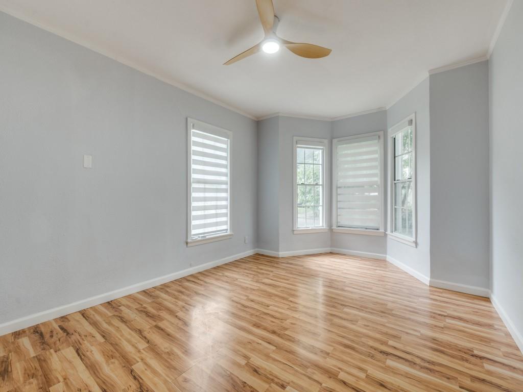 5739 Ellsworth Avenue Dallas, TX 75206 - Photo 25 of 38 an empty room with wooden floor and windows