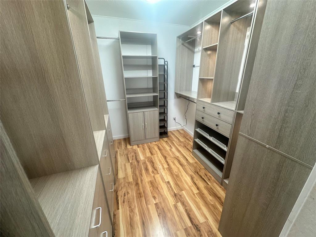 5739 Ellsworth Avenue Dallas, TX 75206 - Photo 28 of 38 a kitchen with white cabinets and stainless steel appliances