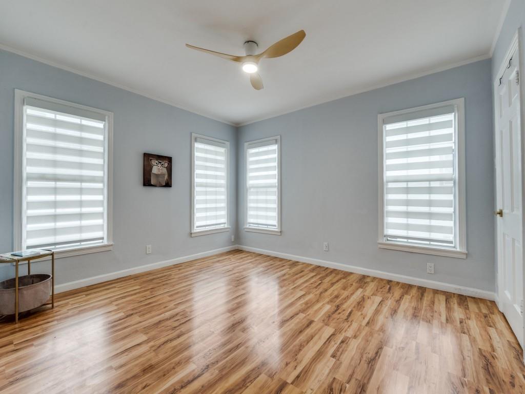 5739 Ellsworth Avenue Dallas, TX 75206 - Photo 30 of 38 a view of an empty room with wooden floor and a window