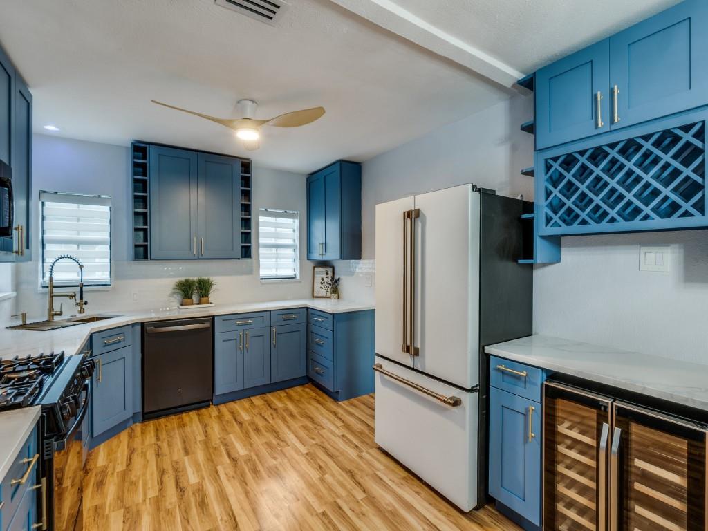 5739 Ellsworth Avenue Dallas, TX 75206 - Photo 3 of 38 a kitchen with a refrigerator sink and stove