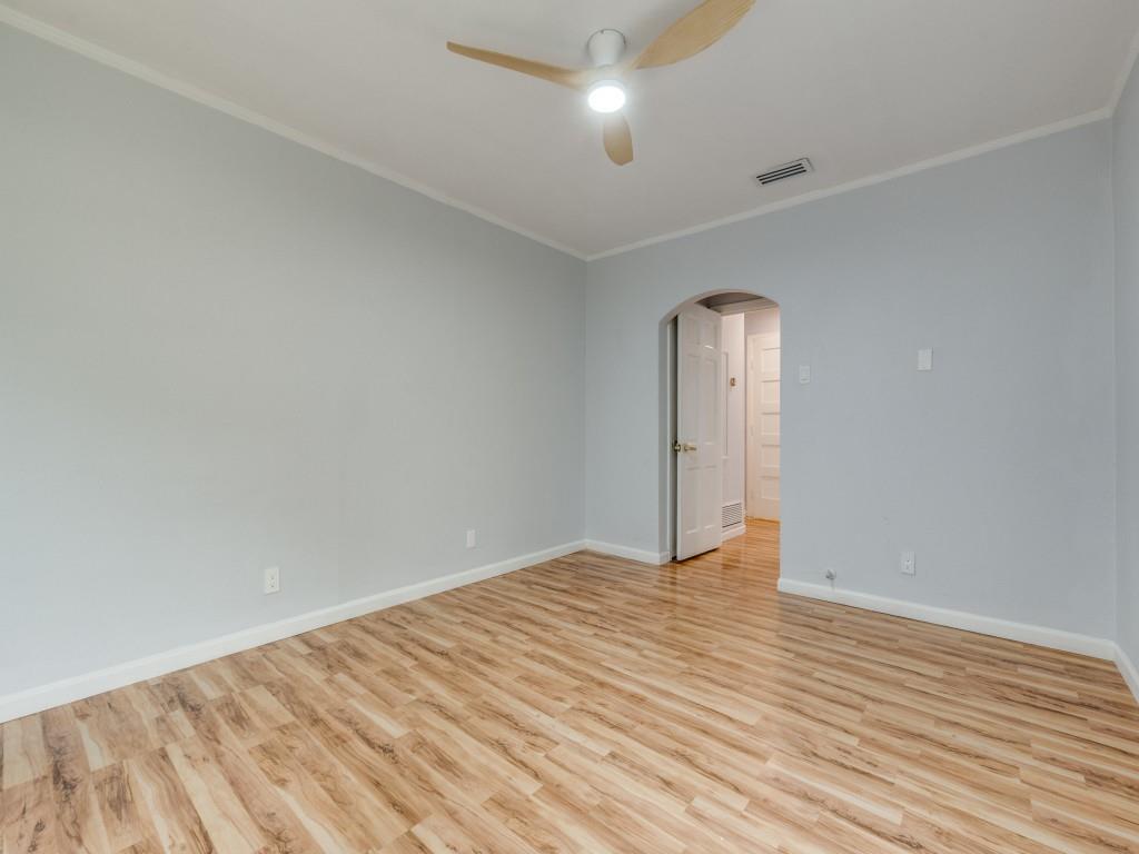 5739 Ellsworth Avenue Dallas, TX 75206 - Photo 31 of 38 an empty room with wooden floor and windows
