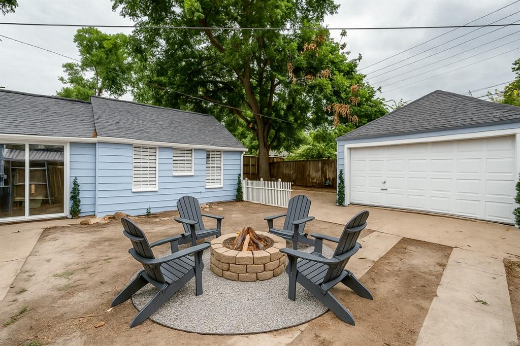 5739 Ellsworth Avenue Dallas, TX 75206 - Photo 36 of 38 a backyard of a house with table and chairs