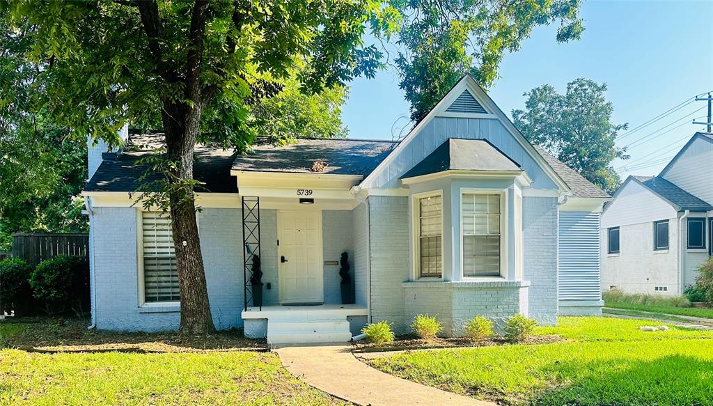 5739 Ellsworth Avenue Dallas, TX 75206 - Photo 38 of 38 a front view of a house with a yard