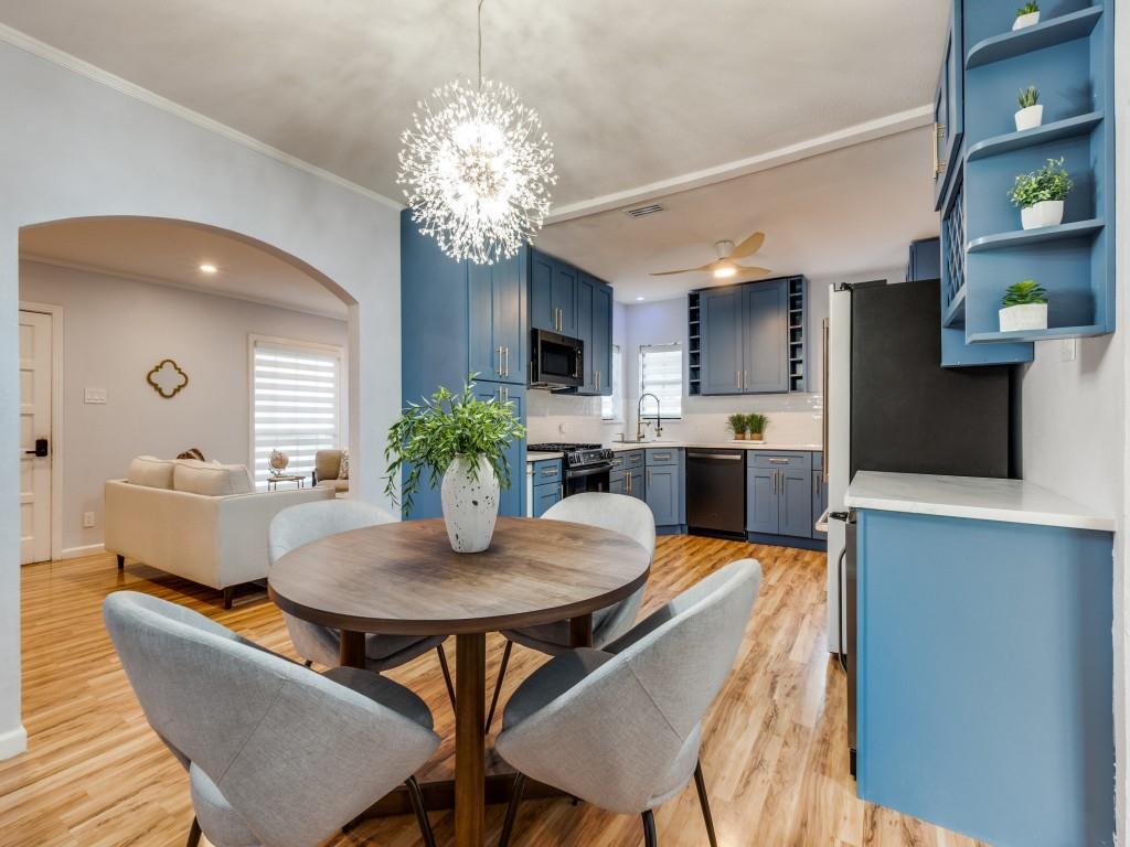 5739 Ellsworth Avenue Dallas, TX 75206 - Photo 4 of 38 a view of a dining room with furniture and a chandelier