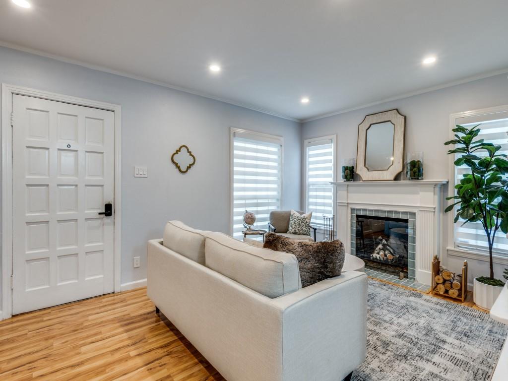 5739 Ellsworth Avenue Dallas, TX 75206 - Photo 7 of 38 a living room with furniture and a fireplace