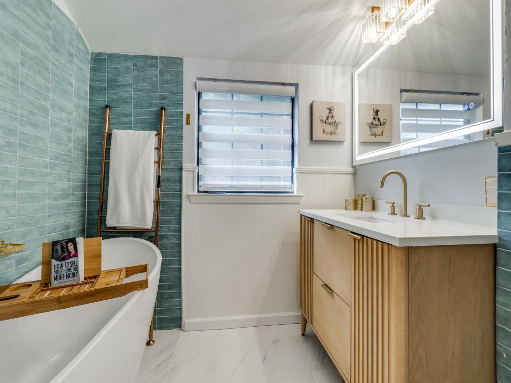 5739 Ellsworth Avenue Dallas, TX 75206 - Photo 9 of 38 a bathroom with a sink and a bathtub