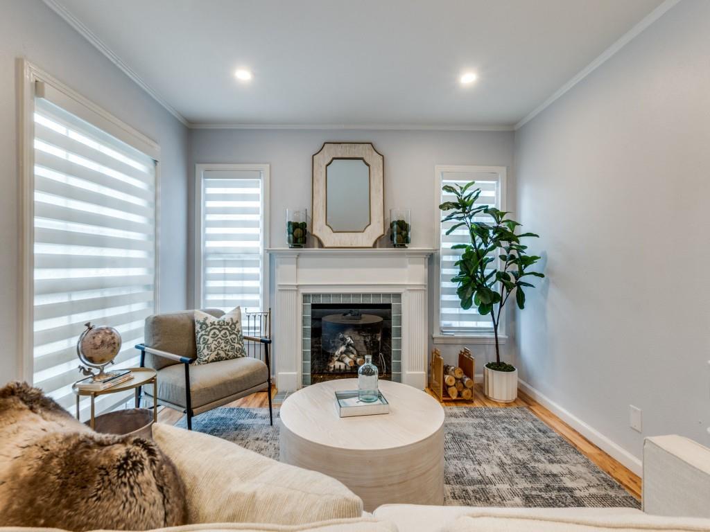 5739 Ellsworth Avenue Dallas, TX 75206 - Photo 10 of 38 a living room with furniture and a fireplace