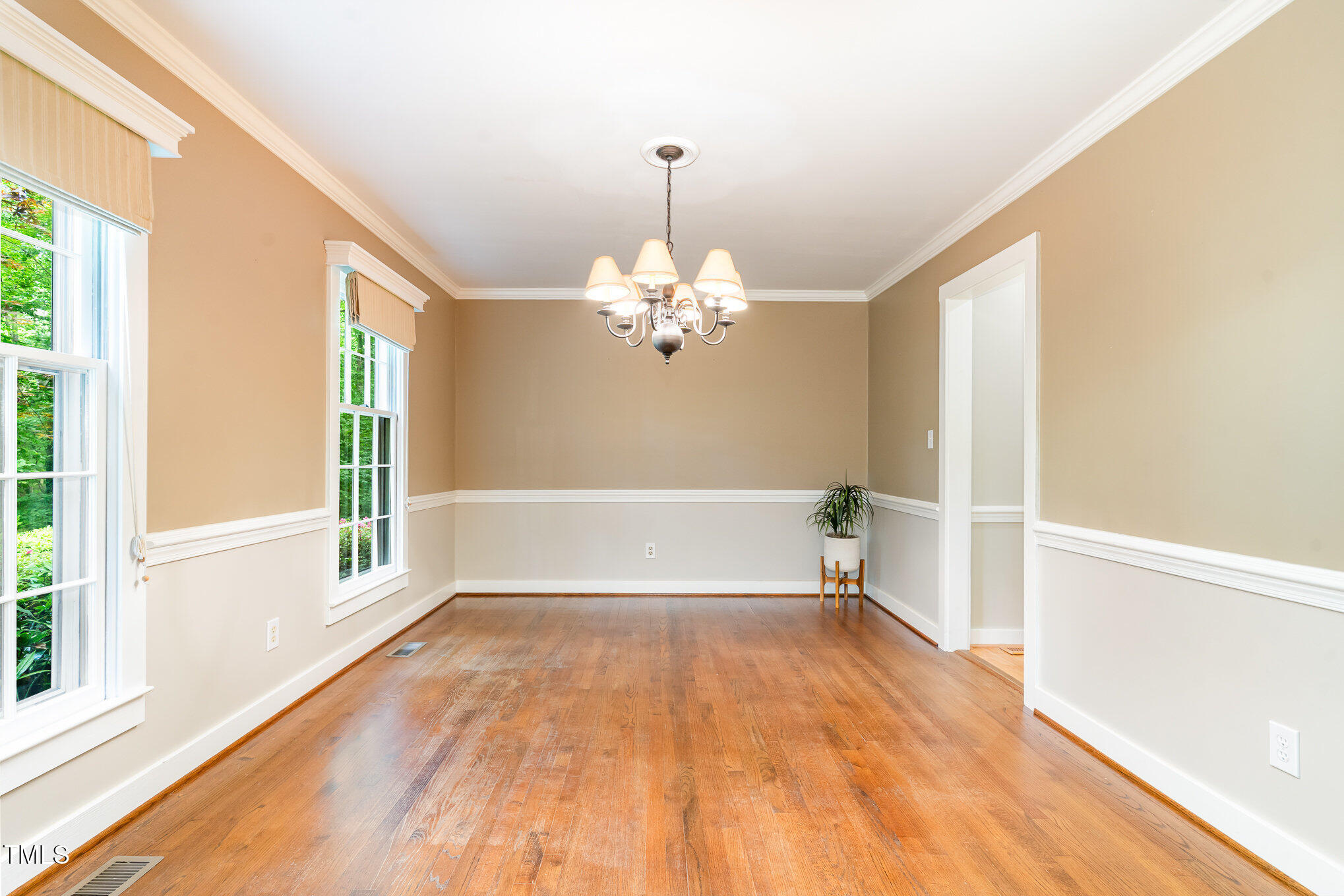 12709 Timberlane Court Raleigh, NC 27613 - Photo 12 of 44 a view of an empty room with a window