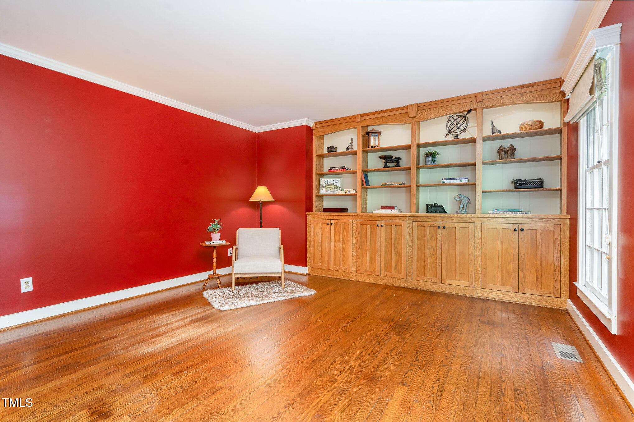 12709 Timberlane Court Raleigh, NC 27613 - Photo 16 of 44 a view of a room with wooden floor and chair