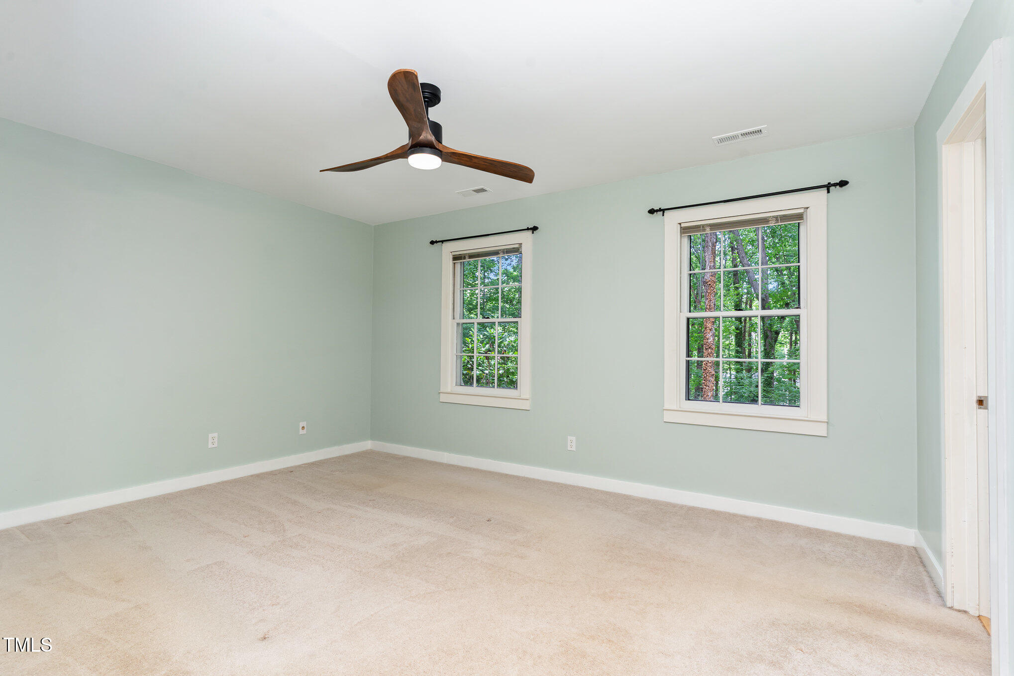 12709 Timberlane Court Raleigh, NC 27613 - Photo 18 of 44 a view of an empty room with a window
