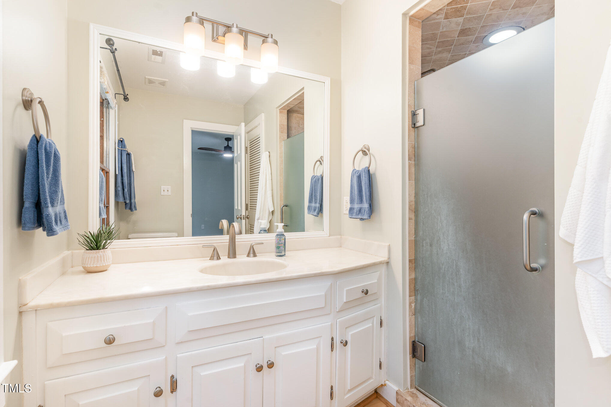 12709 Timberlane Court Raleigh, NC 27613 - Photo 20 of 44 a bathroom with a double vanity sink and mirror