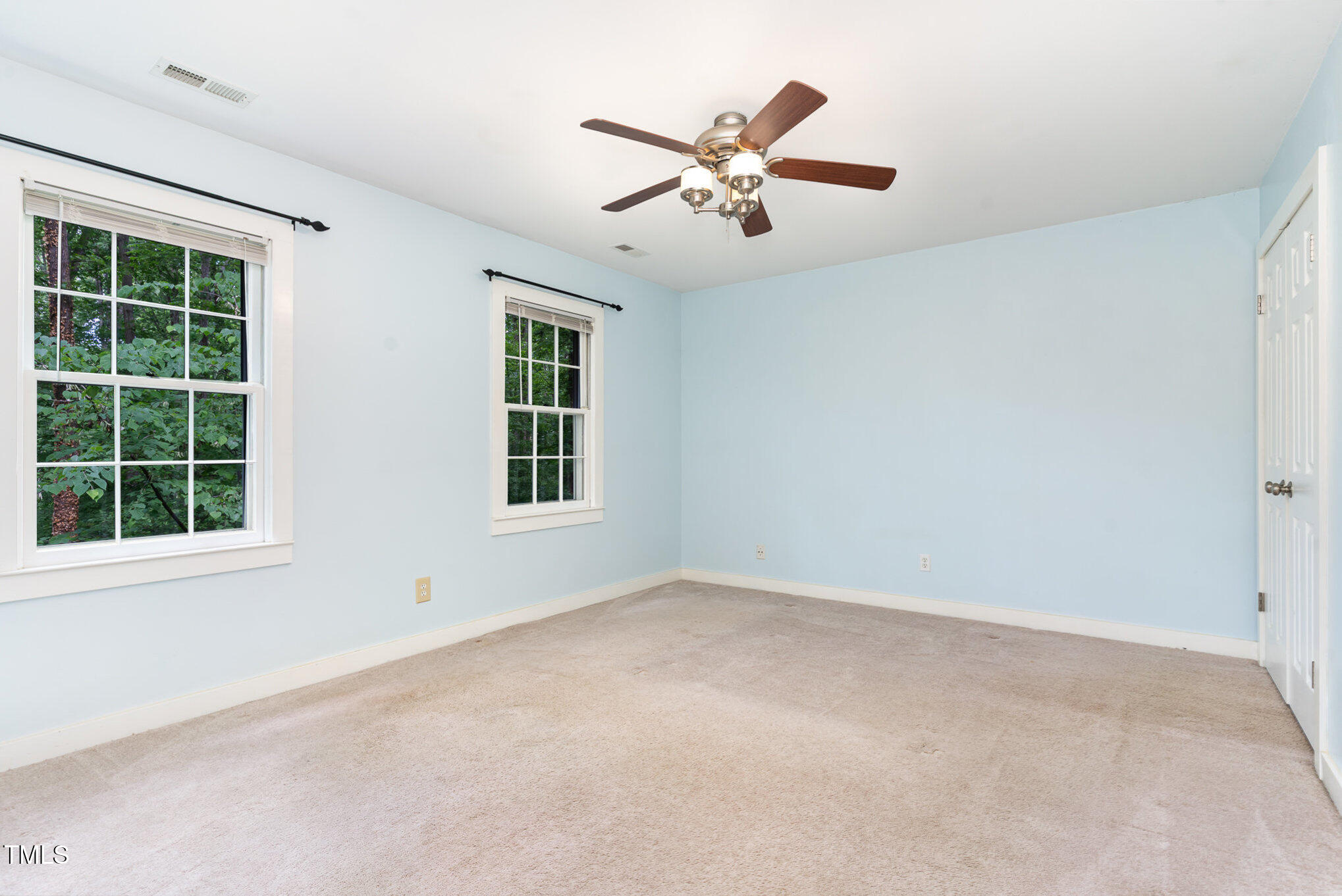 12709 Timberlane Court Raleigh, NC 27613 - Photo 21 of 44 an empty room with window and ceiling fan