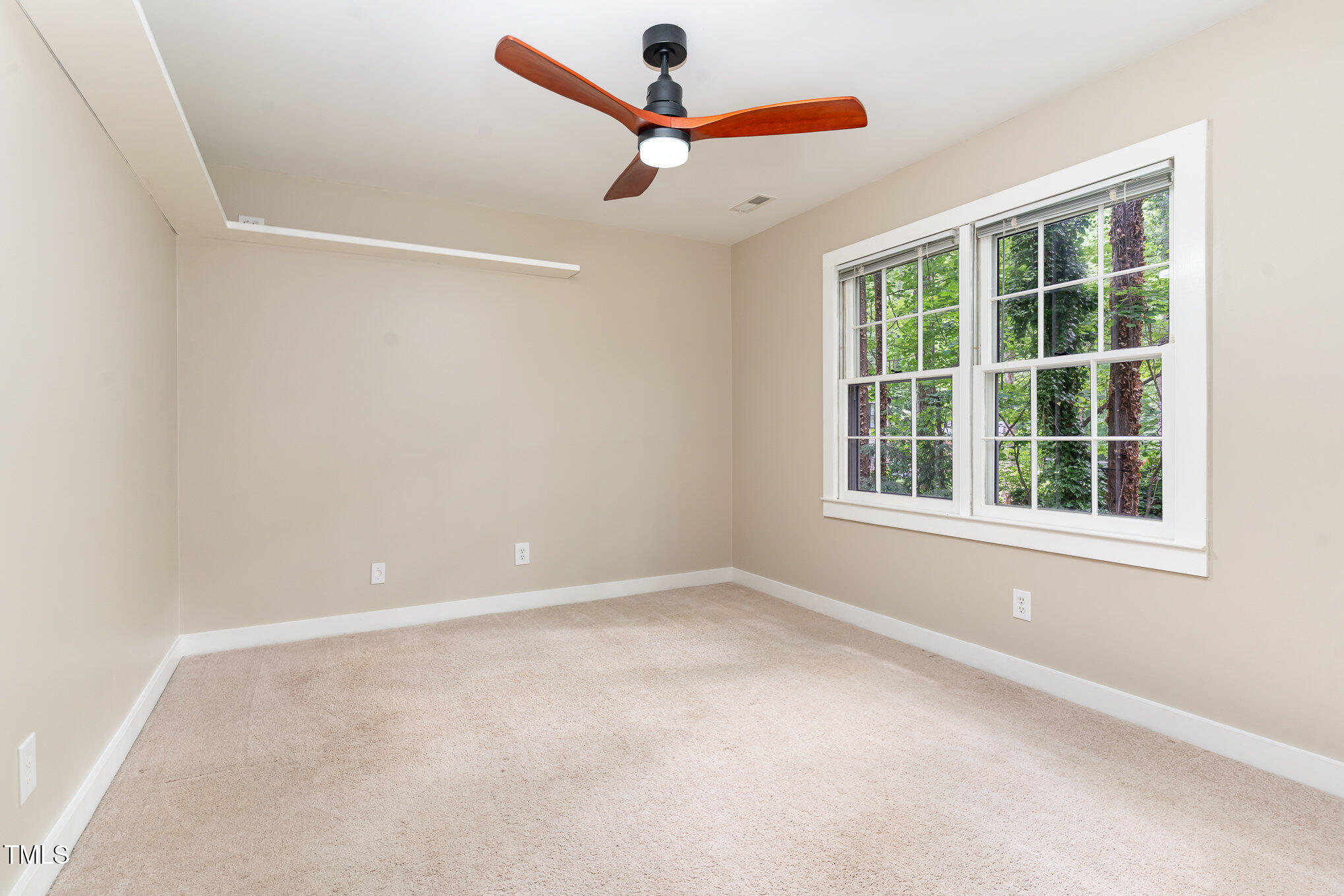12709 Timberlane Court Raleigh, NC 27613 - Photo 22 of 44 an empty room with window and fan