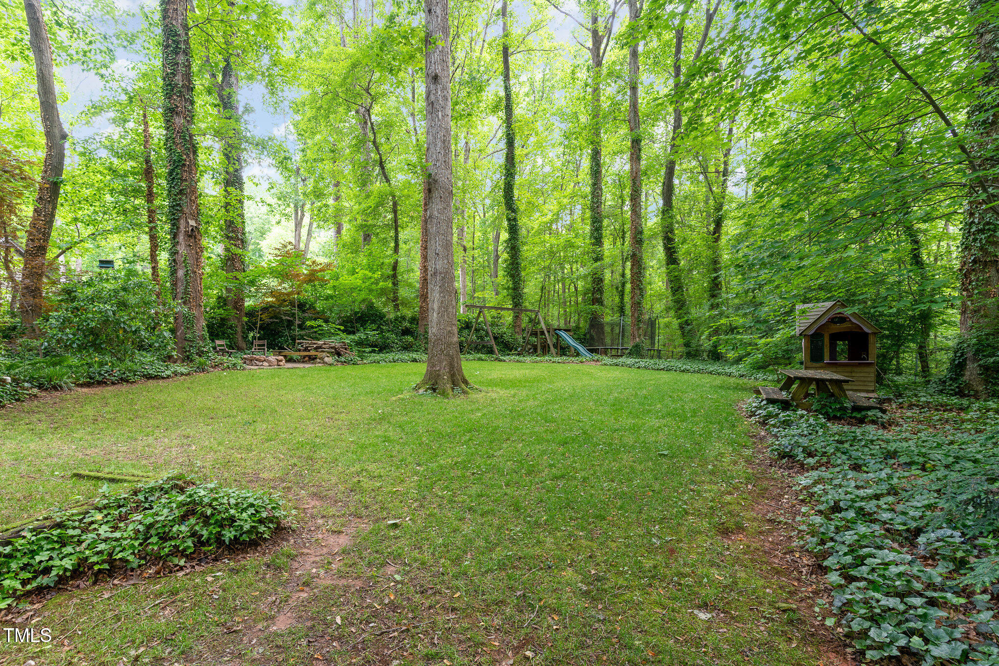12709 Timberlane Court Raleigh, NC 27613 - Photo 34 of 44 a view of a garden with trees