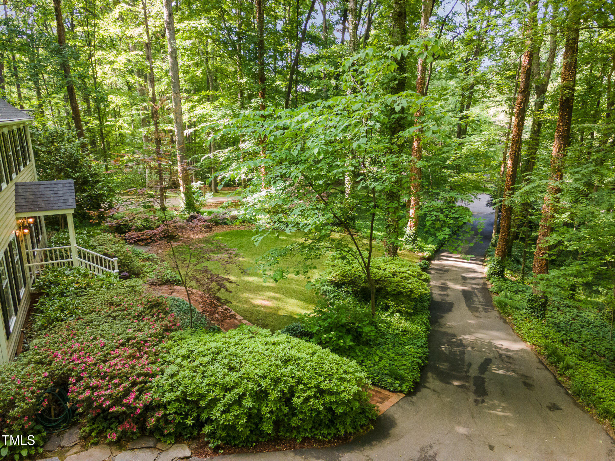 12709 Timberlane Court Raleigh, NC 27613 - Photo 37 of 44 a view of a garden with a bench