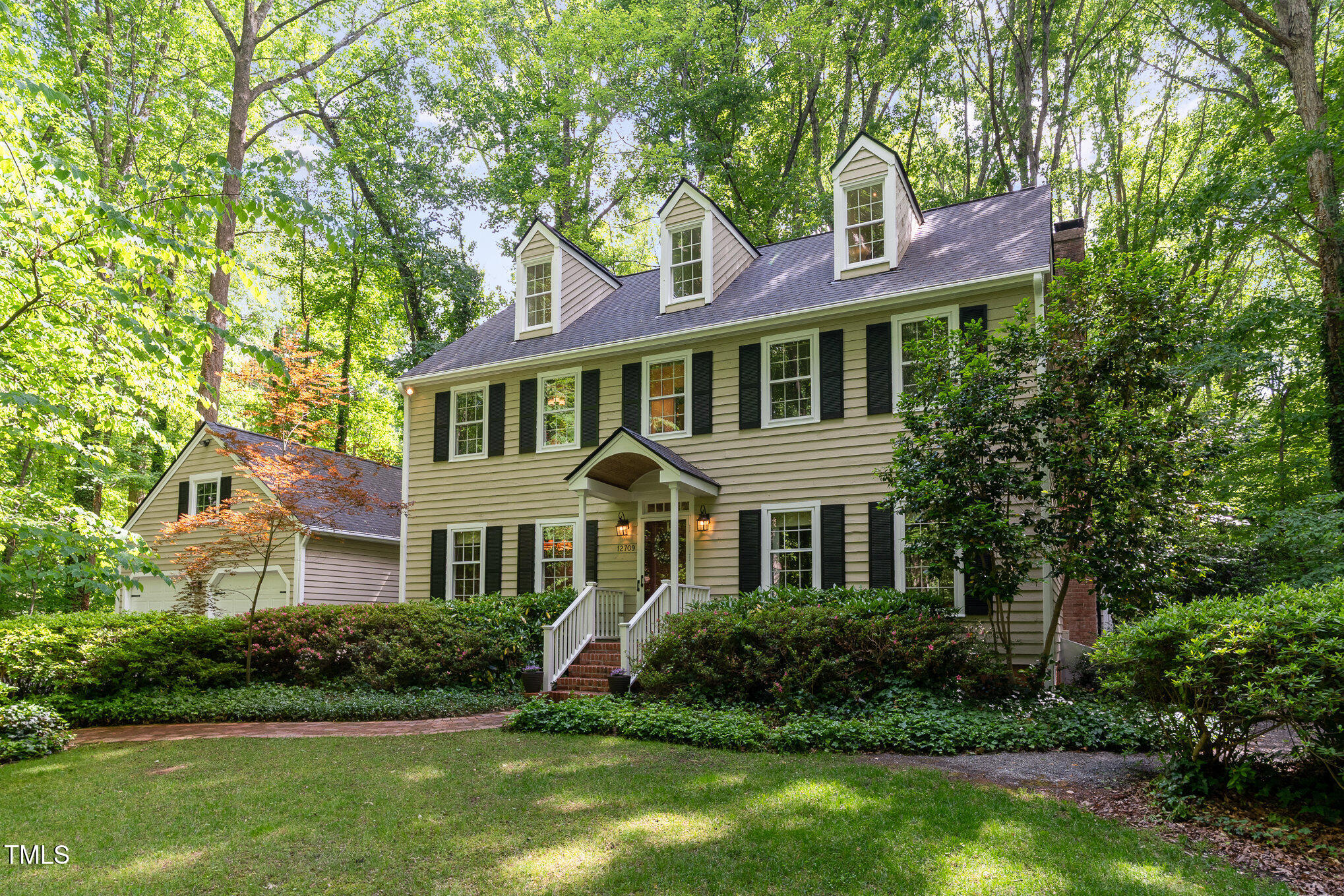 12709 Timberlane Court Raleigh, NC 27613 - Photo 6 of 44 a front view of a house with a yard